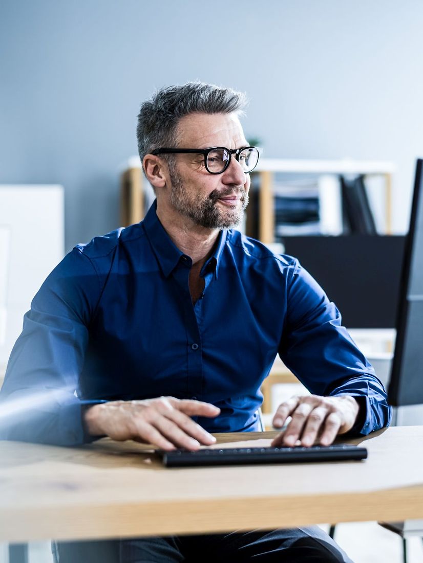 Businessman with business computer in office