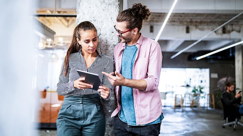 A woman and a man exchange ideas about productive processes.