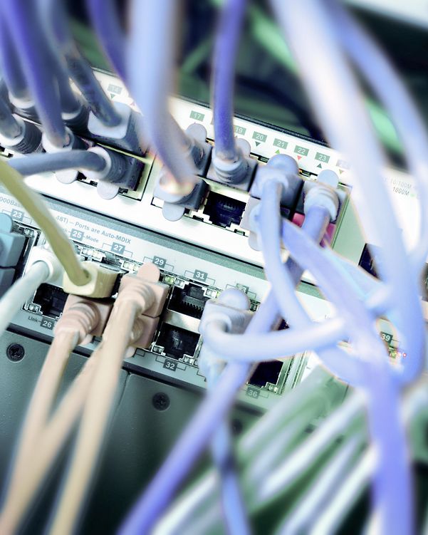 Photo of a server with a lot of LAN cables