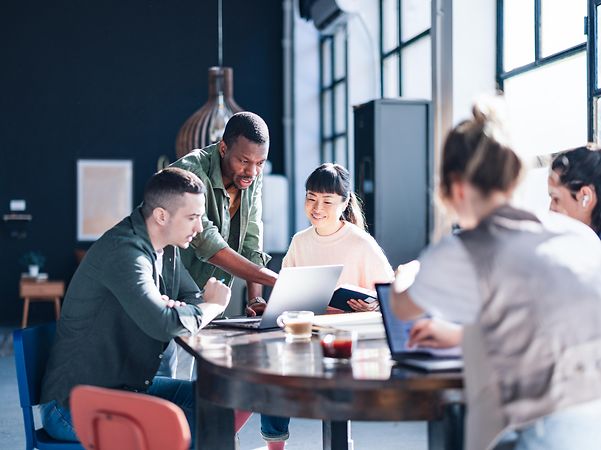 Diverse team working together in a modern co-working space