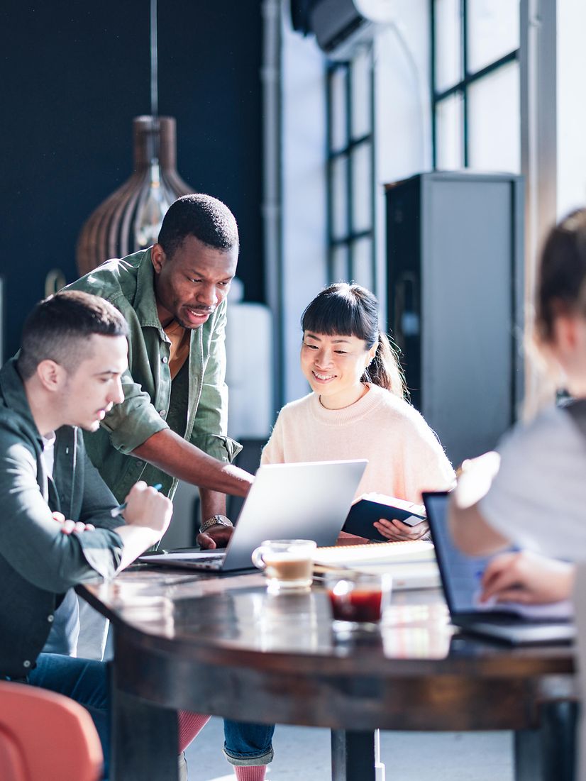 Diverse team working together in a modern co-working space