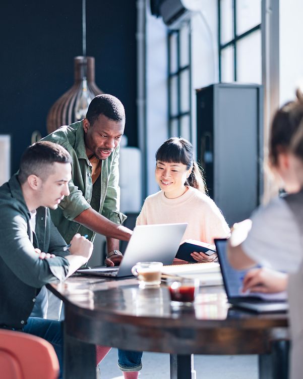 Diverse team working together in a modern co-working space