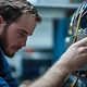 A technician works on a Telekom server cabinet.