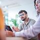 Confident professional conducts interview with customers