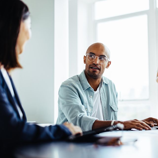 Business people engaged in a discussion during a meeting