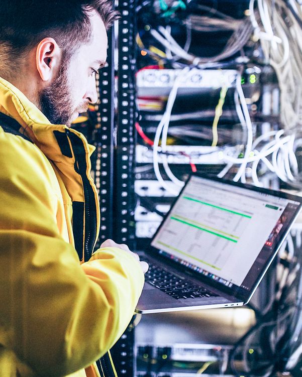 A man analyses data on a server.