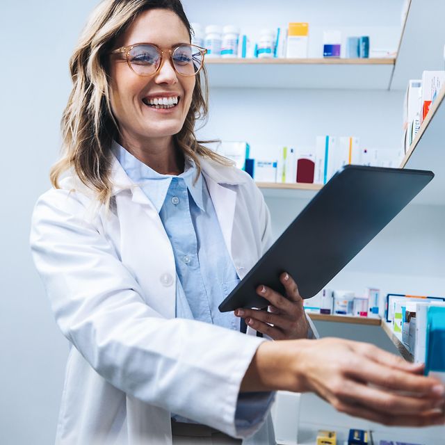 Telematics for pharmacies A pharmacist works on her tablet and searches for relevant medicines.