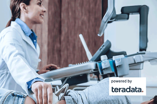 Business Analytics Doctor sits in her practice and examines a patient radiologically