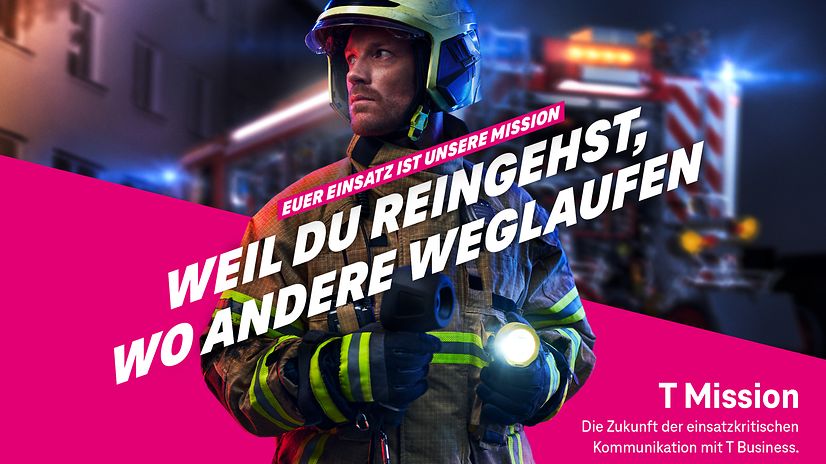 Firefighter on duty against a magenta background.