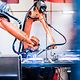 A robotic arm is controlled by artificial intelligence.