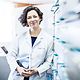 Doctor standing in her practice with a Samsung A series device