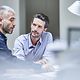 Colleagues chat about the high security standards of Cisco Meraki Managed Service