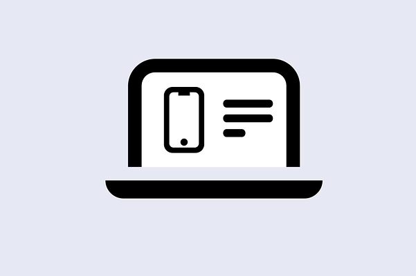 Laptop mit einem Mobiltelefon, daneben steht Text